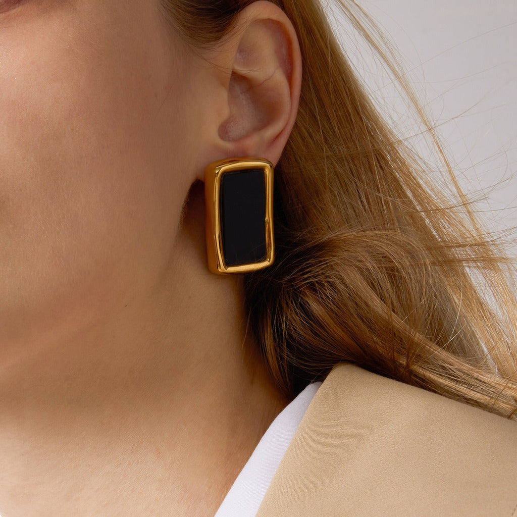 18K gold, black acrylic, and titanium steel stud earrings.