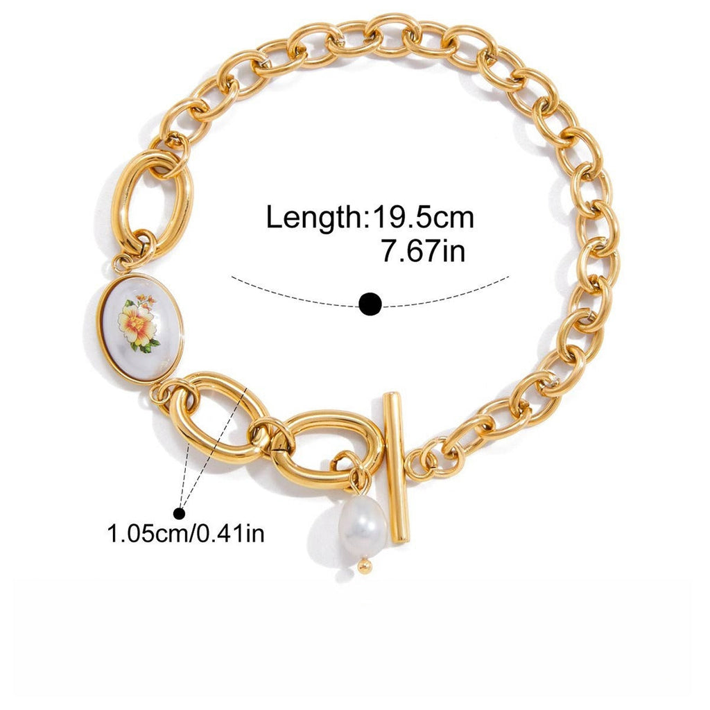 18K gold-plated, lightweight, and luxurious titanium steel bracelet with freshwater pearls.