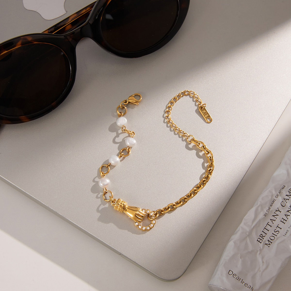 18K gold-plated, lightweight, and luxurious titanium steel bracelet.