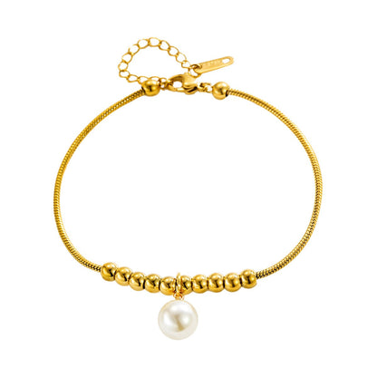 18k gold snake bone beaded anklet with a large heart-shaped heart