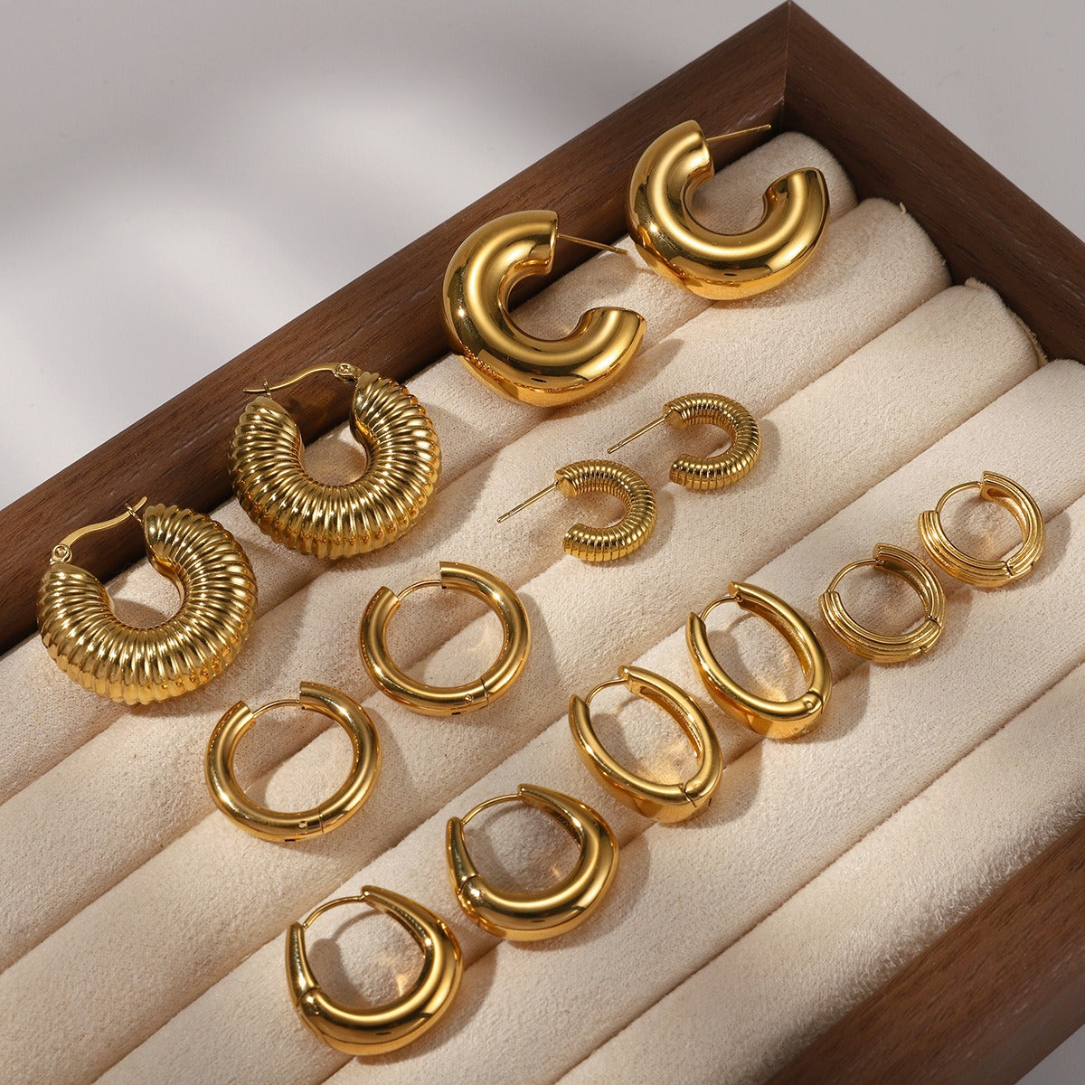 18K gold-plated, lightweight, and luxurious titanium steel stud earrings.