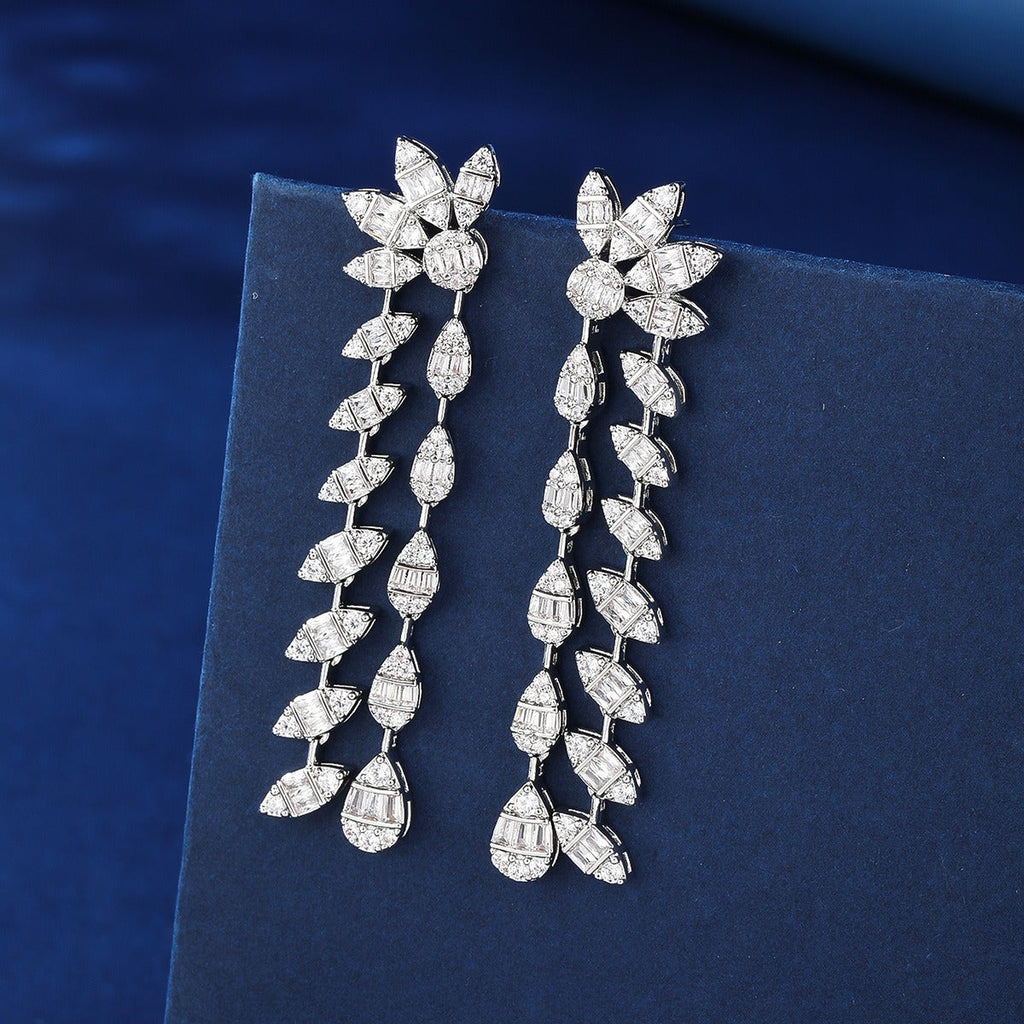 Floral design, fully encrusted with diamonds, double chain leaf earrings.