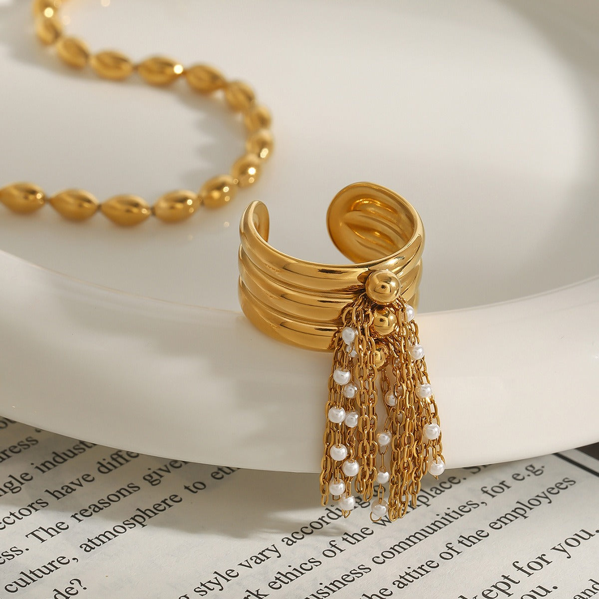 18K gold multi-layered ring with tassel design