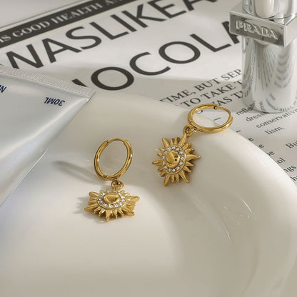 18k gold sun-shaped diamond-studded earrings with unique design