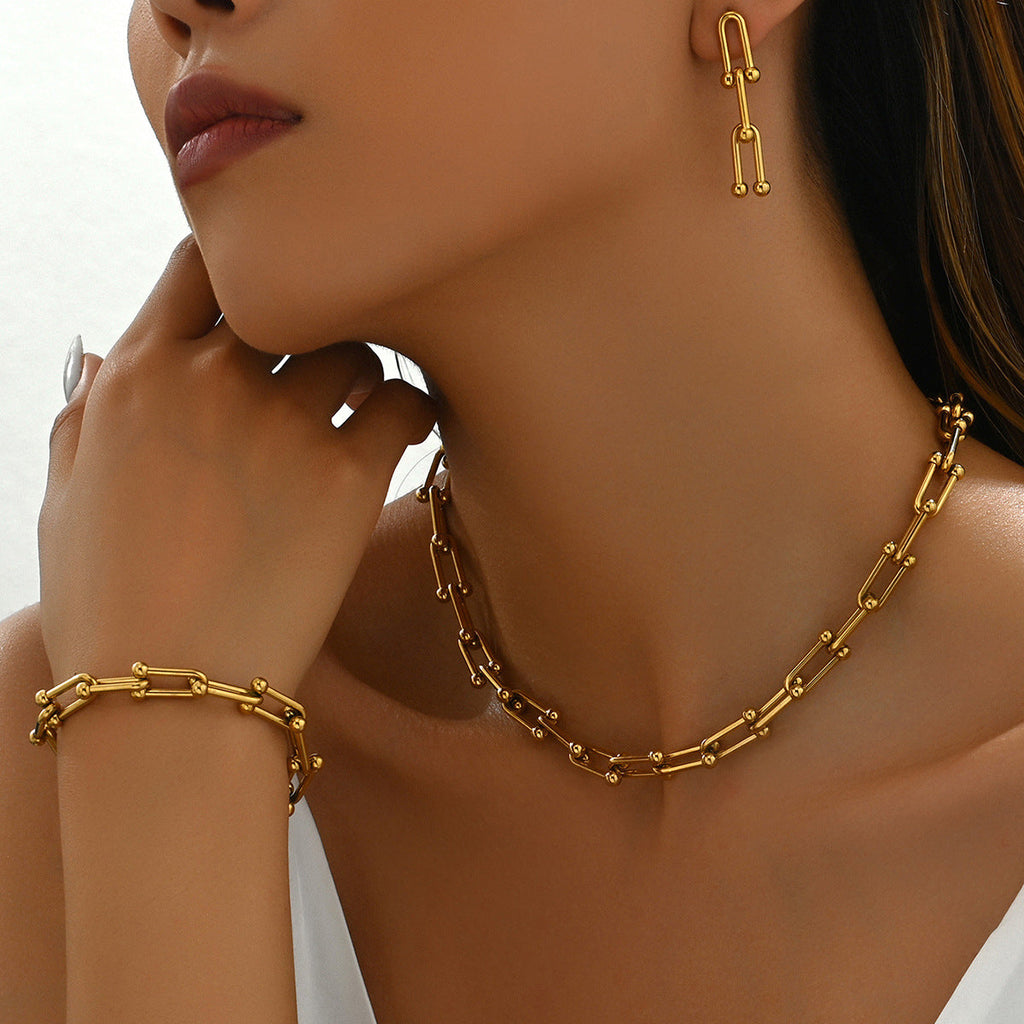 18k gold horseshoe chain bracelet and earrings