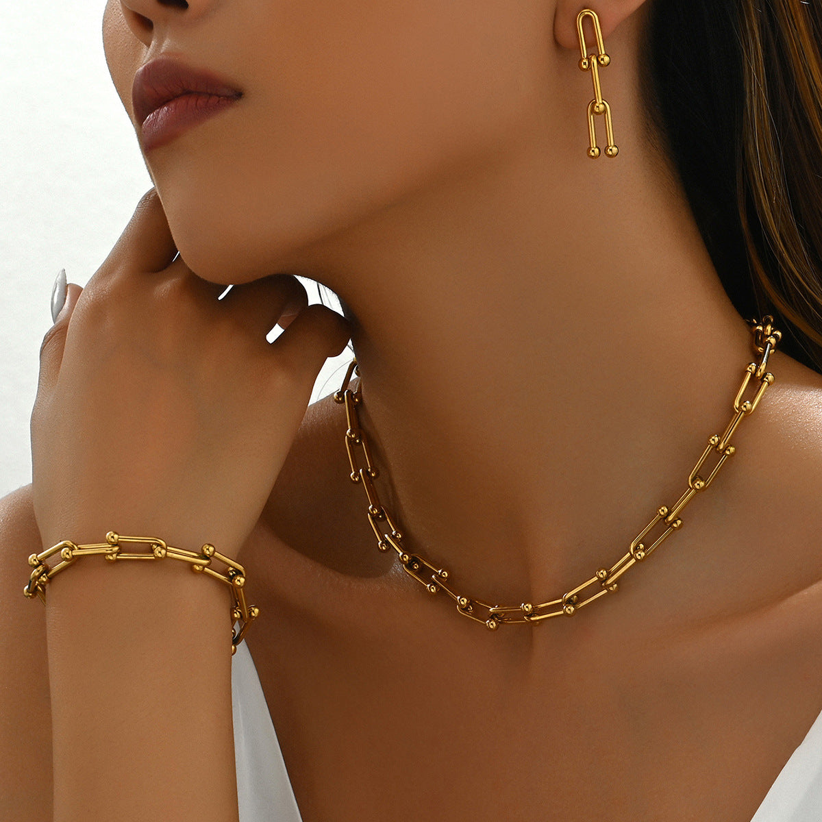 18k gold horseshoe chain bracelet and earrings