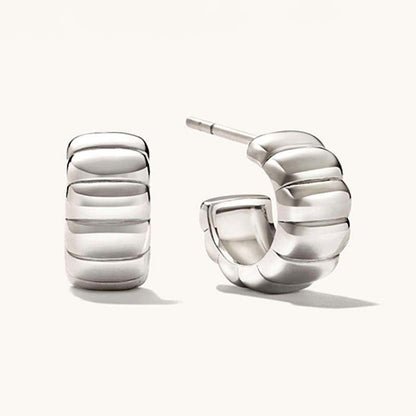 18K gold-plated, solid sterling silver C-shaped hoop earrings.