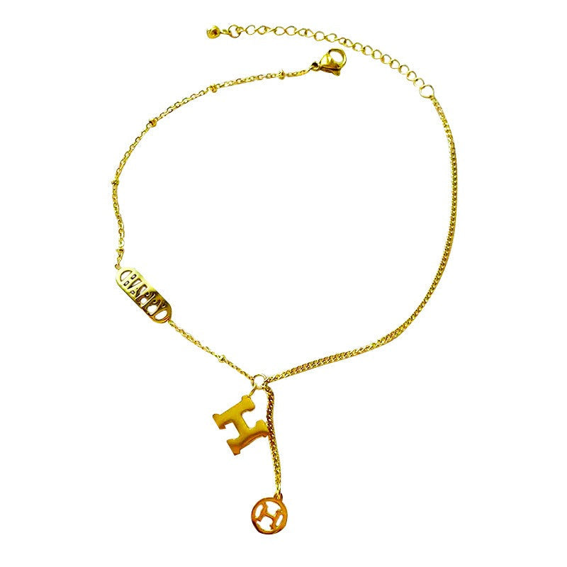 Titanium steel and 18k gold letter H tassel anklet