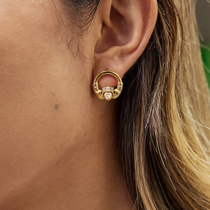 18K gold-plated friendship hand design titanium steel stud earrings with cubic zirconia.
