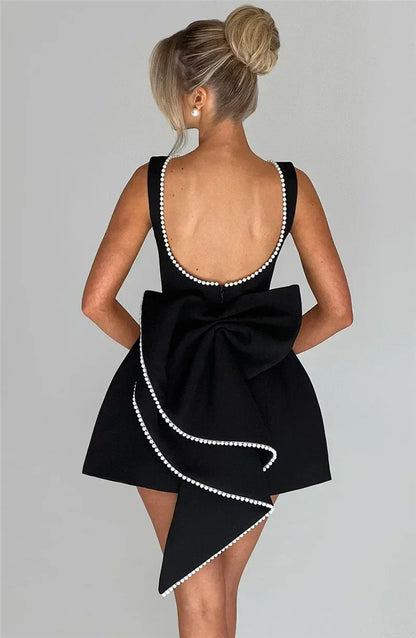 Mozision Pearl Bow Backless Sexy Mini Dress For Women Robe Fashion Zipper Sleeveless High Waist A-line Club Party Dress Elegant