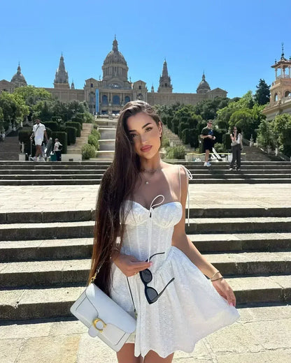 YENKYE Sexy Elegant Women Hollow Out Embroidery Yellow Sling Mini Dress Low Waist Lace Up Bandage Party Dresses Birthday Robe