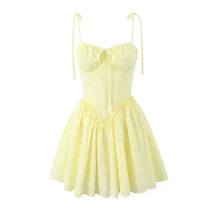 YENKYE Sexy Elegant Women Hollow Out Embroidery Yellow Sling Mini Dress Low Waist Lace Up Bandage Party Dresses Birthday Robe