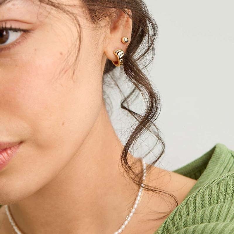 18K gold-plated, solid sterling silver C-shaped hoop earrings.