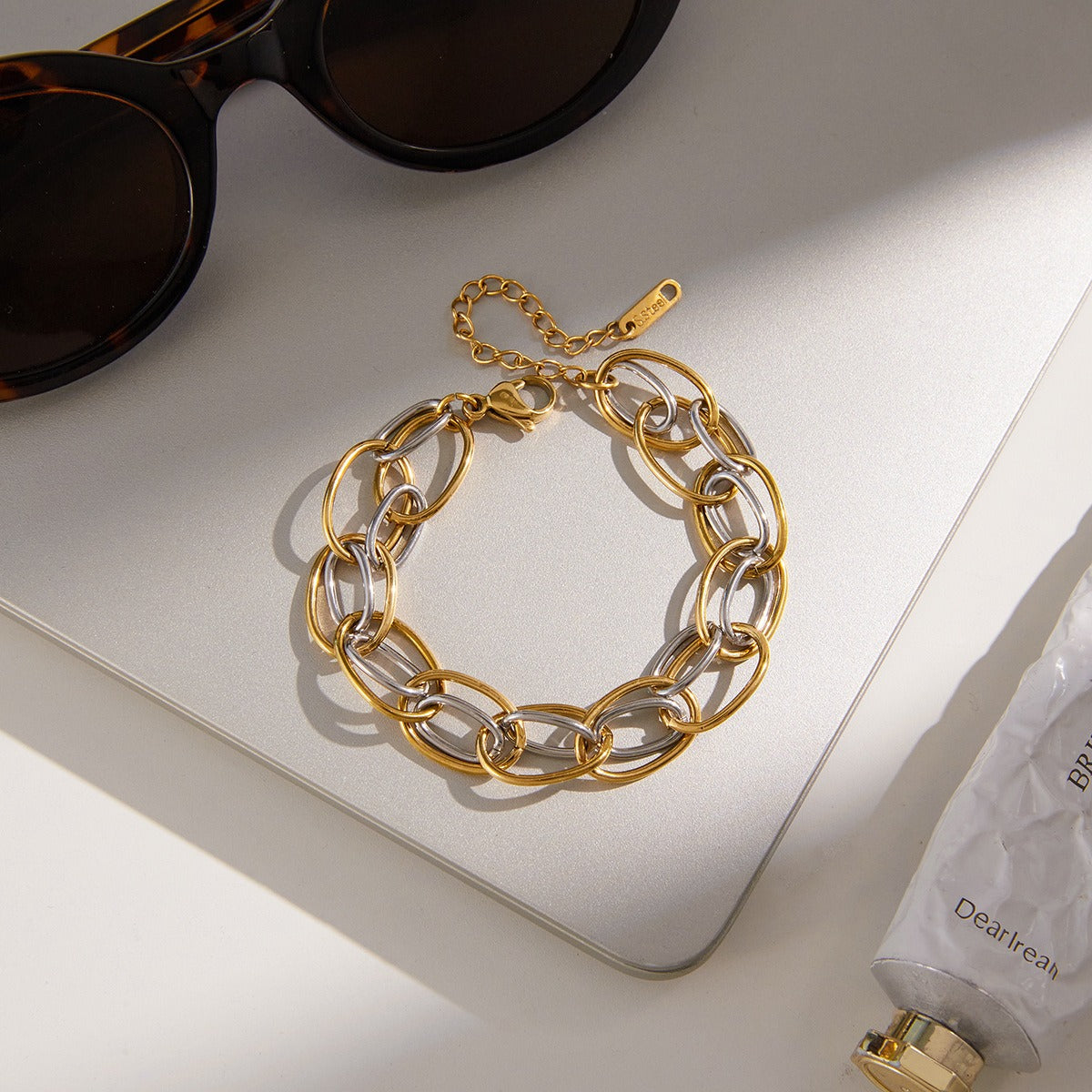 18K gold-plated, lightweight, and luxurious two-tone titanium steel bracelet.