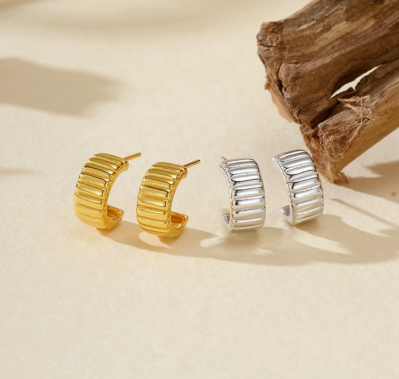 18K gold-plated, solid sterling silver C-shaped hoop earrings.