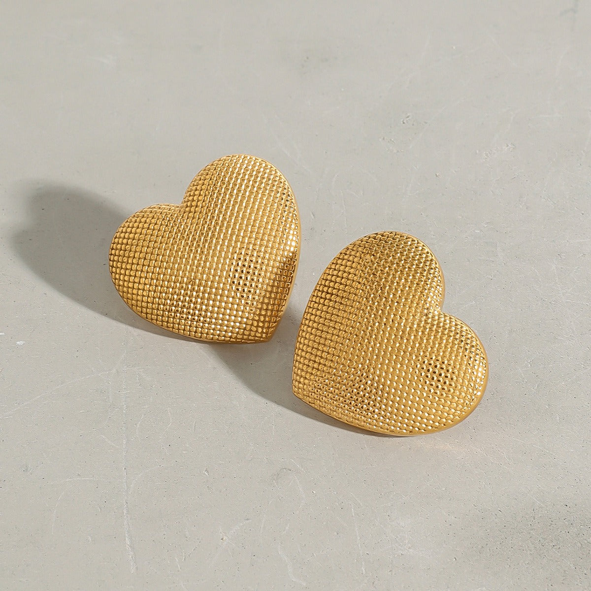 18k gold heart-shaped earrings with grainy design