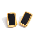 18K gold, black acrylic, and titanium steel stud earrings.